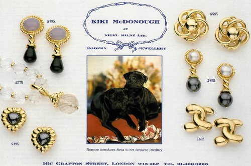 Vintage jewelry advertisement featuring gold and black earrings with a dog illustration and text.