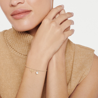 White Topaz Bow Charm Bracelet in 18ct Yellow Gold