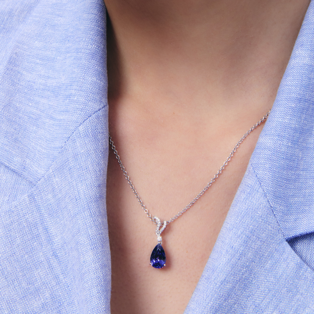 Wings Over Water Pear Tanzanite and Diamond Wave Detail Pendant
